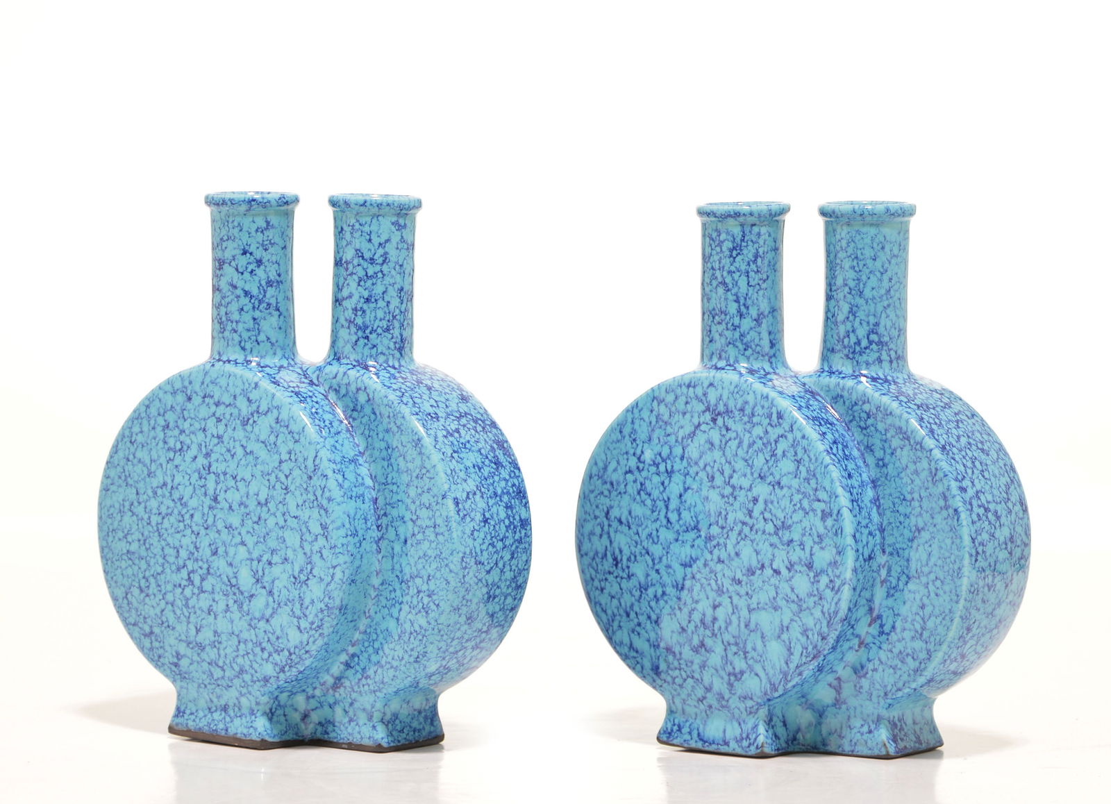 Rare Pair of Robin's Egg Glaze Joint Vases: In shape of moon flask vases with flat sides, covered overall and on the base with a mottled dark blue and turquoise glaze, Qianlong mark on base. H: 19 cm? 7 1/2 IN