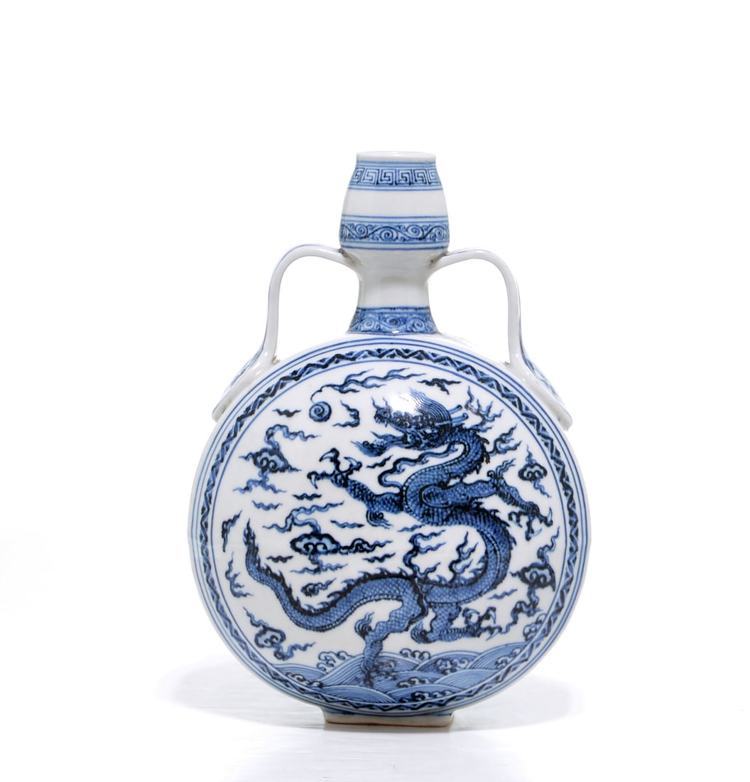 Very Fine Chinese Blue and White Moonflask Vase: The elegant flask is well potted with a flattened, but slightly domed, circular lower section and a globular upper section narrowing to a short neck and a garlic-shape mouth, decorated on each side wi