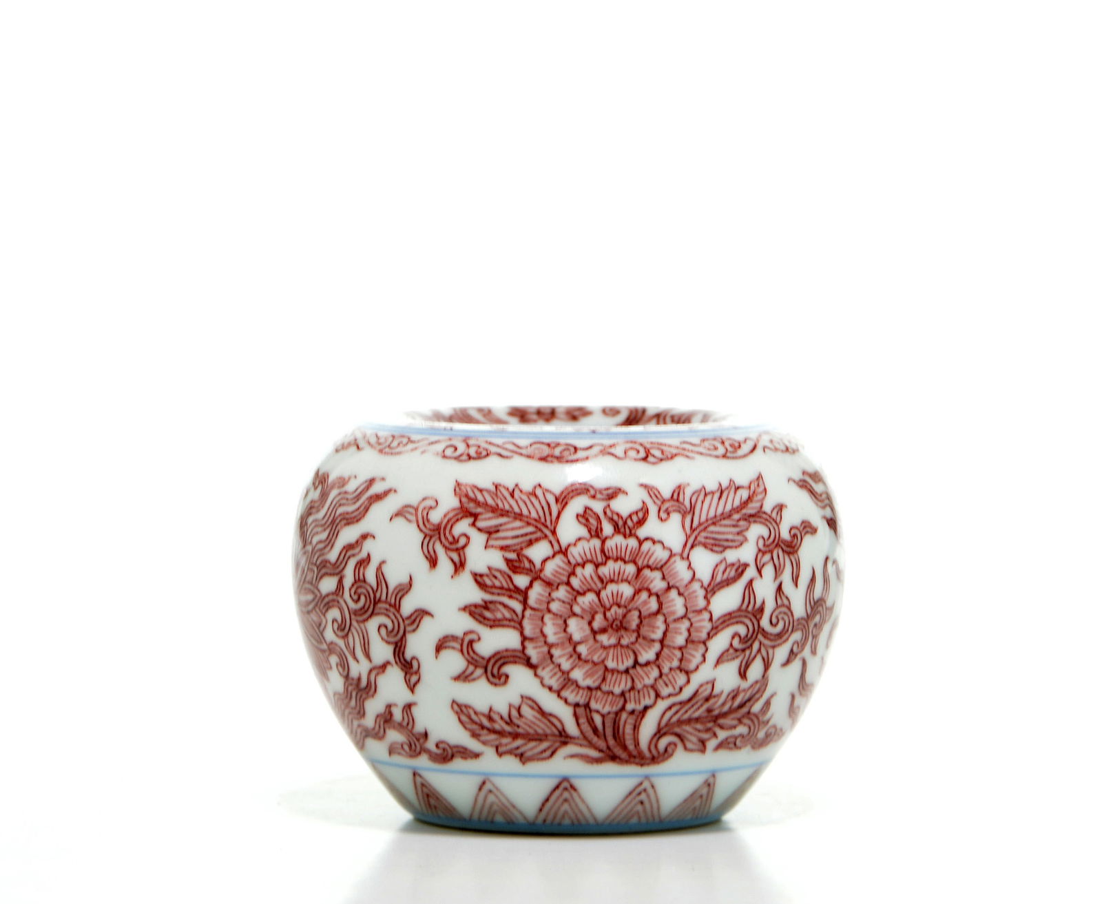 Chinese Kangxi Copper-Red Brush Washer: Compressed globular body masterfully decorated with a continuous scroll of large, blooming peonies and scrolling foliage. The decoration is rendered in a fine, penciled style with vibrant tones of und