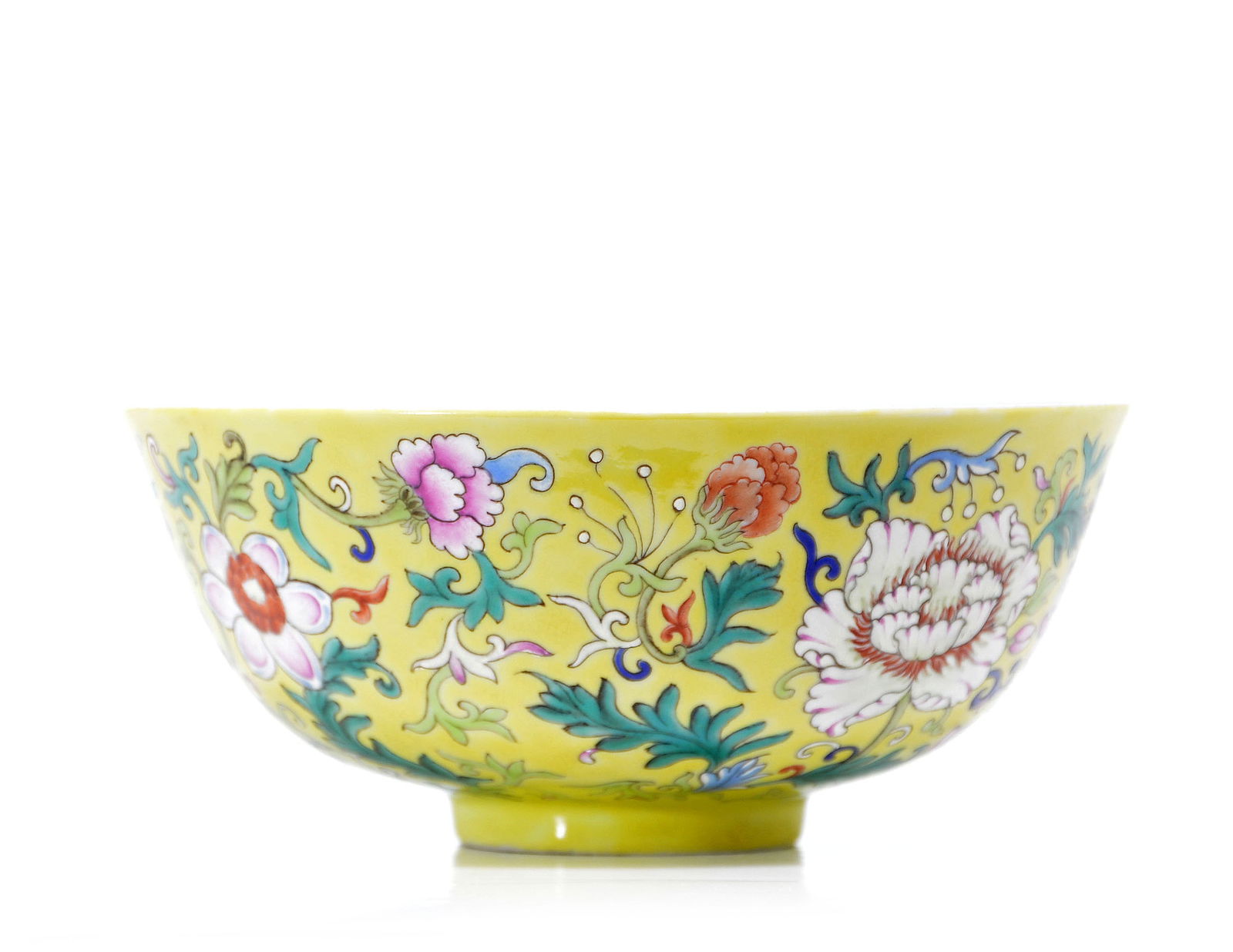 Chinese Imperial Yangcai-Style 'Floral' Bowl: Vibrantly enameled with large, lush peony blossoms and scrolling floral tendrils against a brilliant yellow ground. Jiaqing mark on base.D: 6 IN, 15 CM