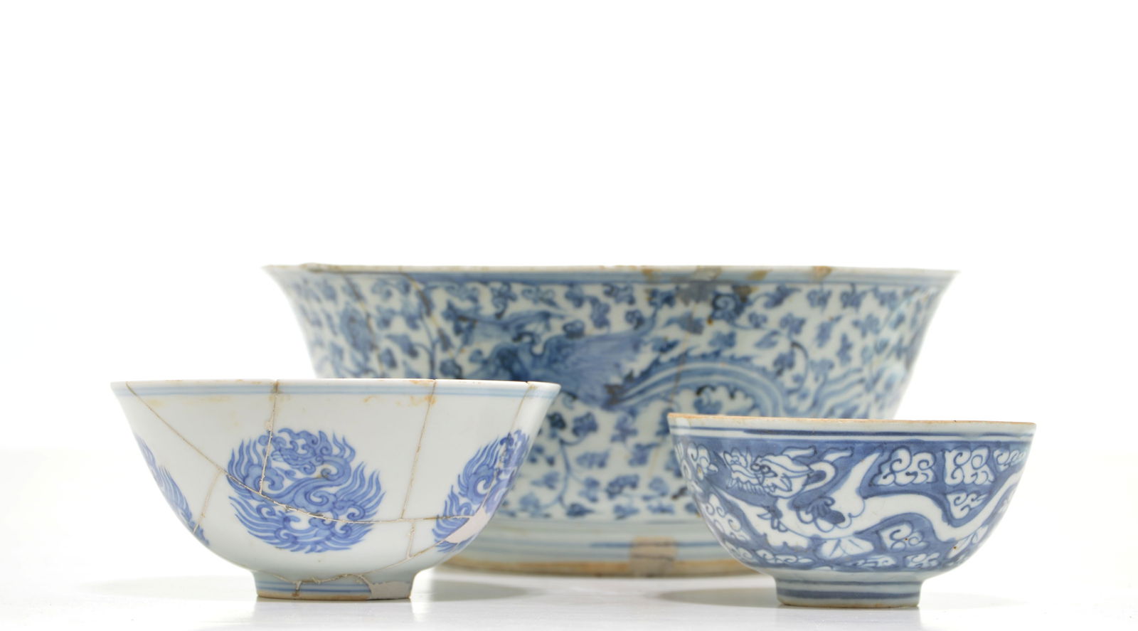 Group of Ming Dyansty Blue and White Bowls: Including an extremely rare survivor of the Chenghua period, featuring a delicate potting and smooth, "oil-like" glaze typical of the period. The exterior is decorated with circular phoenix