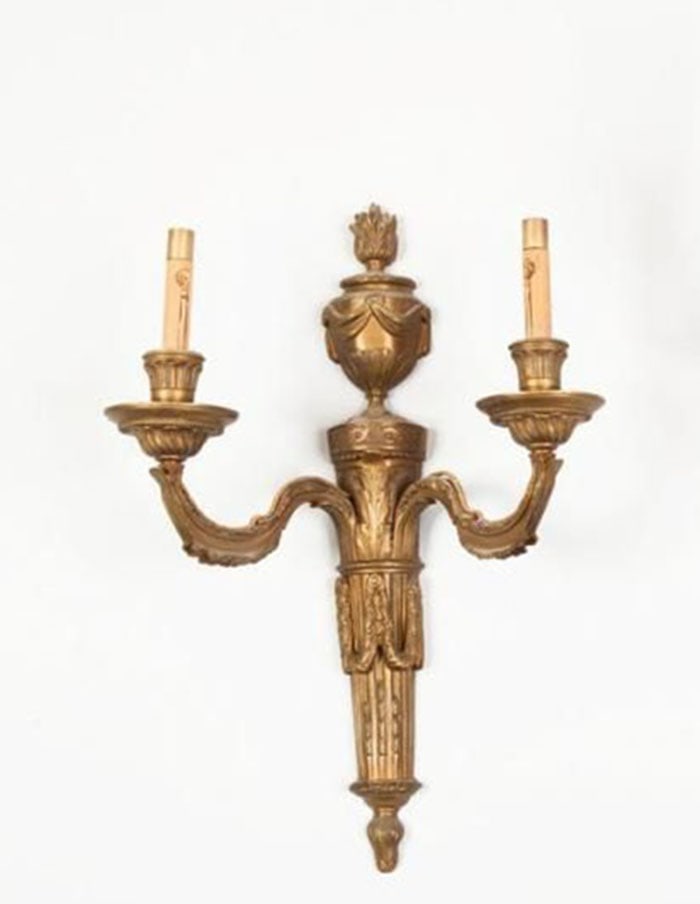 Louis XVI Style Gilt-Bronze Sconce: Brass wall sconce featuring two curved arms and a central decorative column. The mounting piece includes carved vertical lines and an urn-shaped top. H: 17 CM