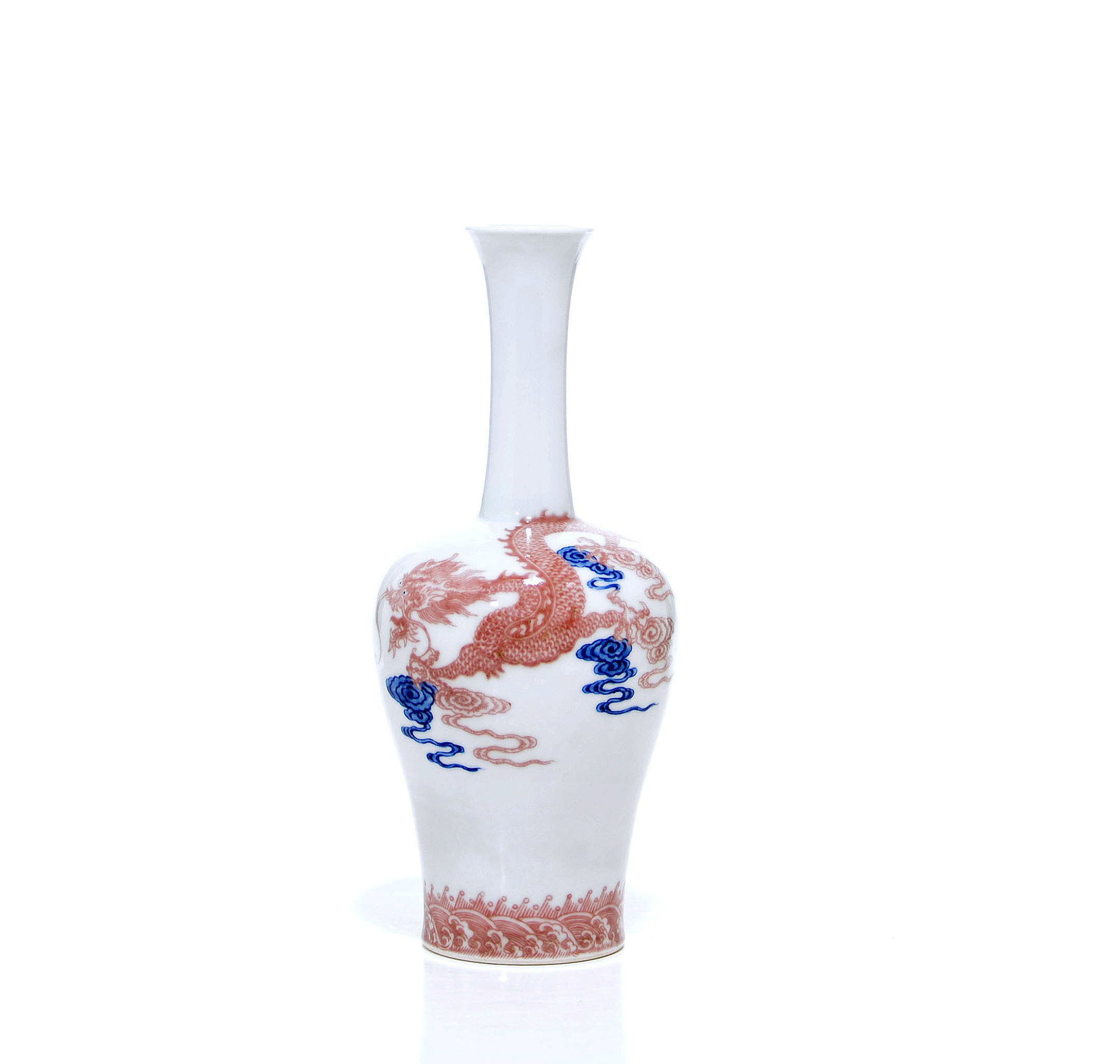 Fine Chinese Blue and White Dragon Vase: Porcelain vase with a long neck and tapered body featuring a copper-red dragon among blue clouds. Red wave patterns encircle the base. Qianlong mark on base. H: 26 CM, 10 1/4 IN