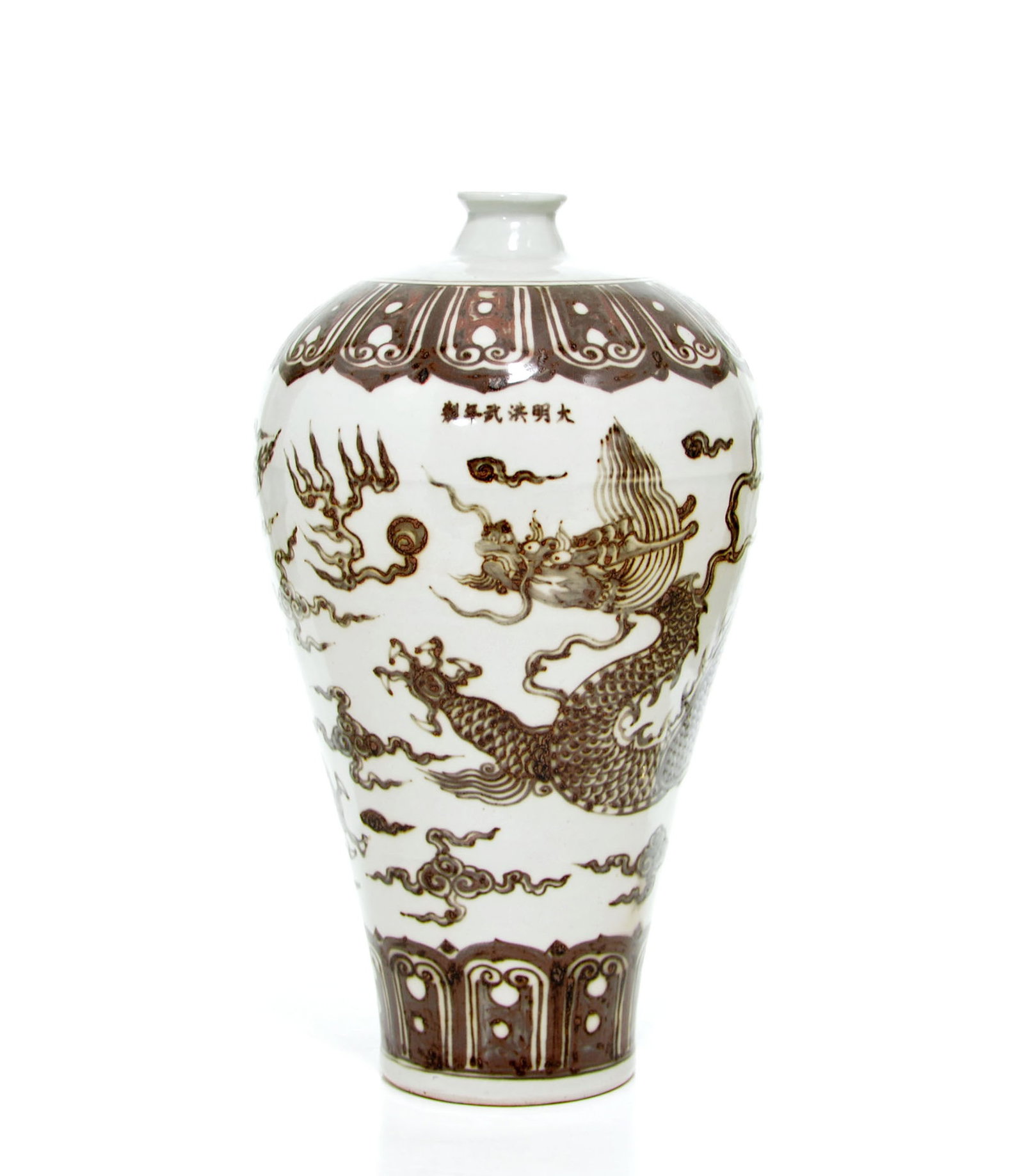 Rare Chinese Copper-Red Dragon Vase: Vase of meiping form, exquisitely decorated in deep underglaze tones with a powerful scaly dragon surging through stylized clouds. The vessel features a broad band of petal lappets at the shoulder