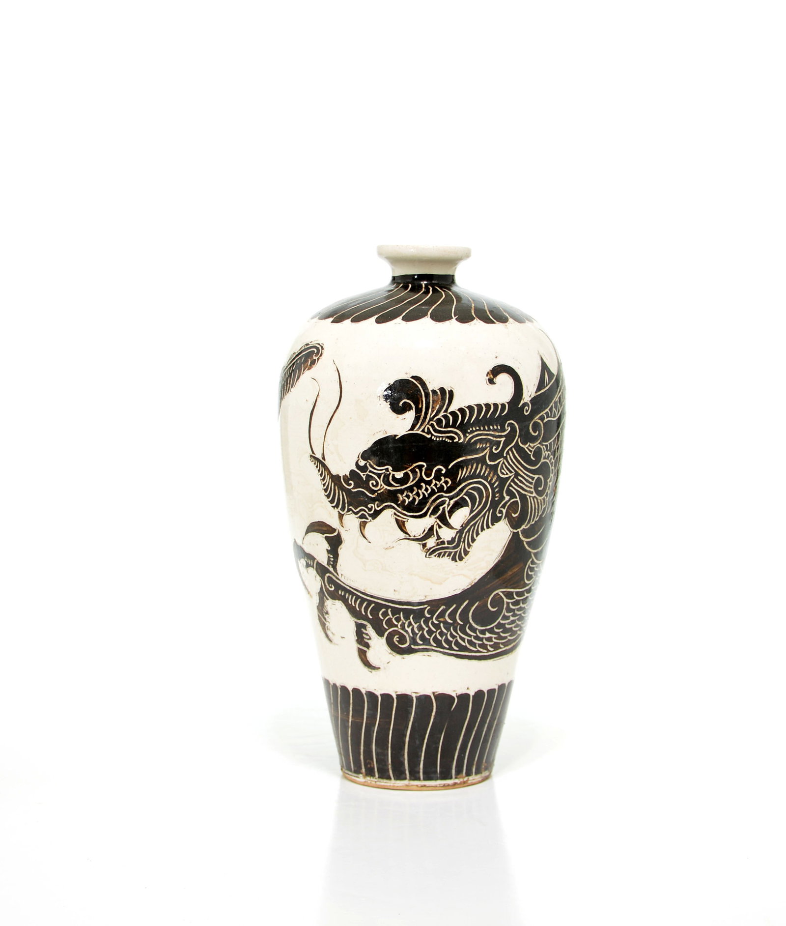 Chinese Cizhou Dragon Vase: Meiping vase of elegant high-shouldered form, masterfully decorated in contrasting dark slip with a spirited, sinuous dragon. The mythical beast is rendered with dynamic energy across the central
