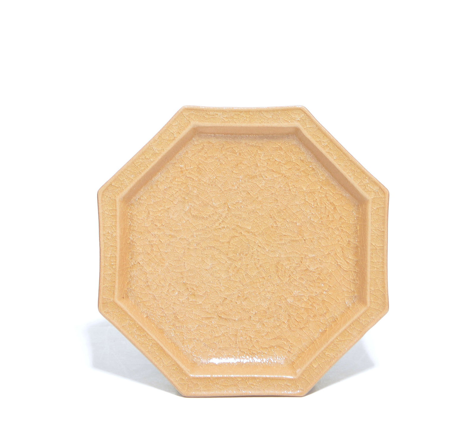 Very Fine Chinese Geyao Crackle Glazed Dish: Octagonal dish of elegant proportions, characterized by a luminous honey-hued glaze permeated with an intricate web of fine crackle. The piece features a shallow, recessed well enclosed by eight