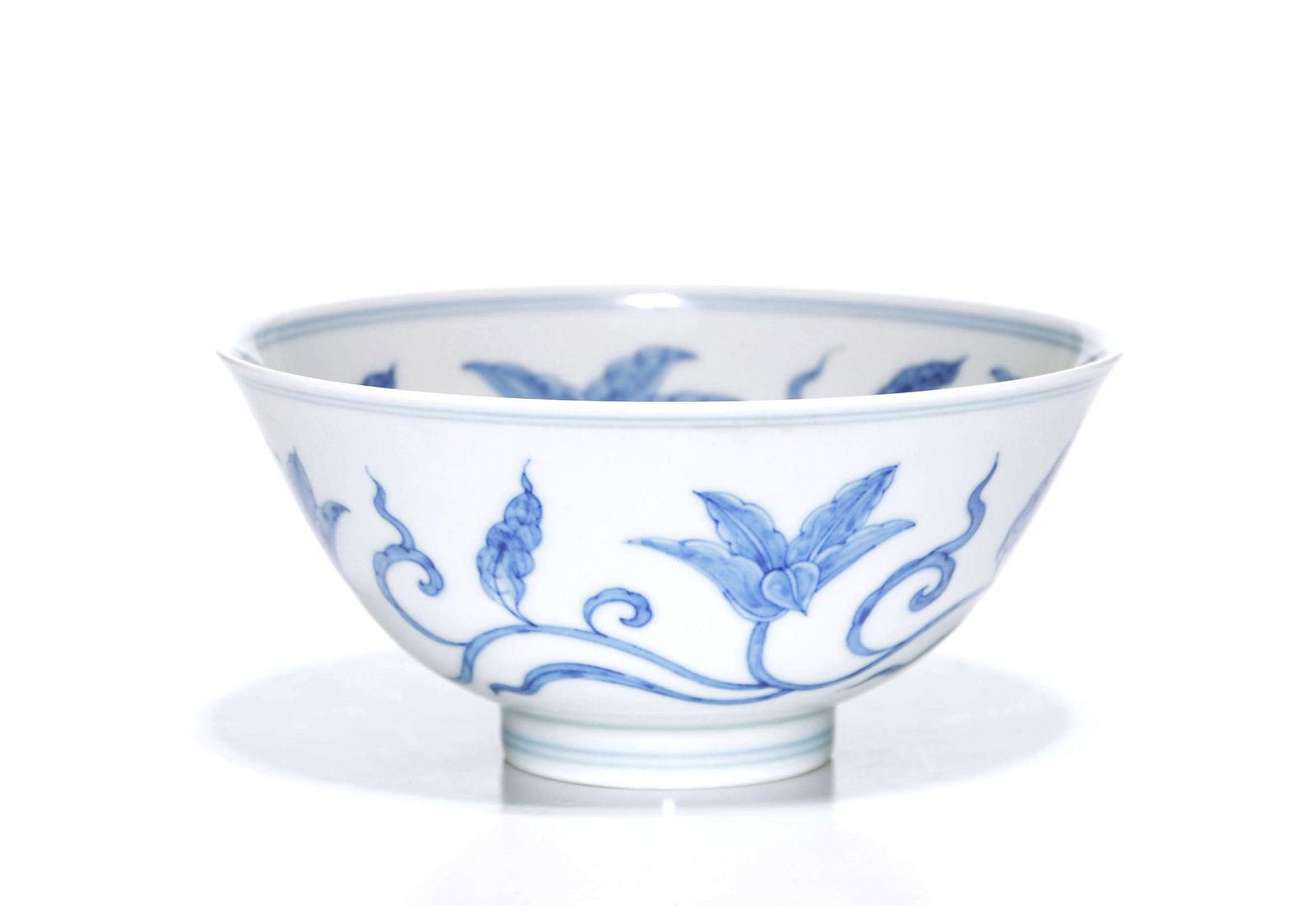 Superb Chinese Blue And White 'Palace' Bowl: Bowl features an elegantly potted body rising from a short, tapered foot to a gently flared rim. The exterior is masterfully painted in vibrant cobalt blue with a continuous scroll of lilies and