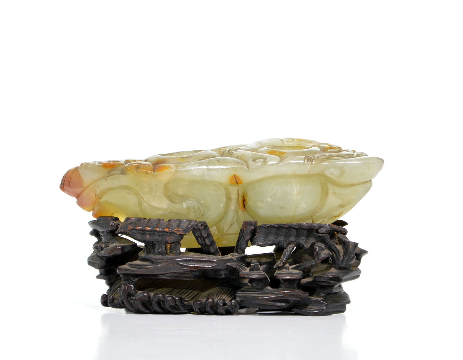 Chinese Carved Jade 'Dragon' Brush Washer: Carved nephrite vessel of pale celadon tone, the stone masterfully worked in high relief with archaistic scrollwork and utilizing the natural russet skin for decorative emphasis. The object features t