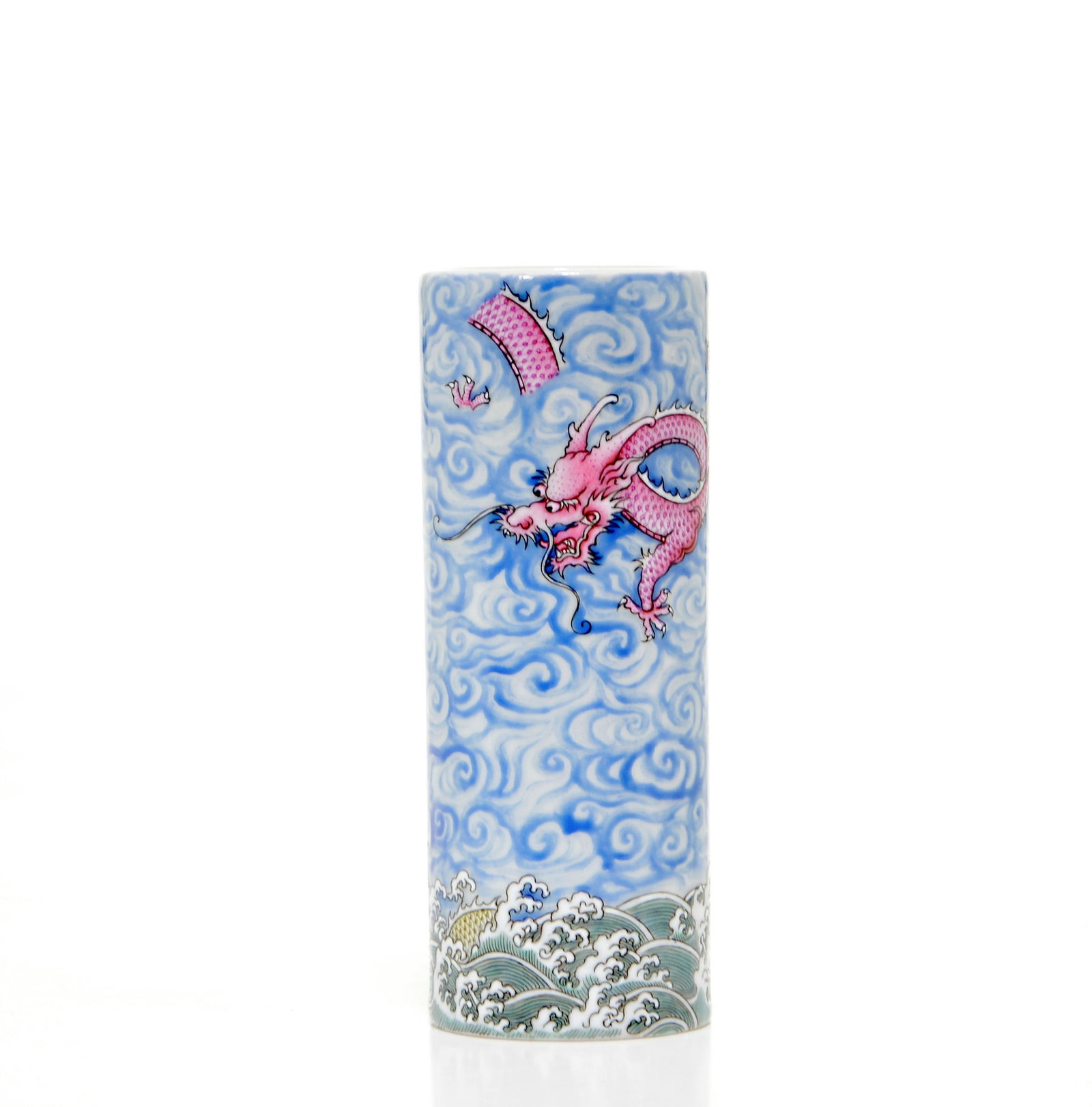 Chinese Famille Rose 'Dragon' Brush Pot: Cylindrical vessel of slender, upright form, expertly rendered with a pair of spirited dragons amidst a dense ground of swirling blue ruyi-form clouds. One dragon is painted in vibrant pink enamels, w