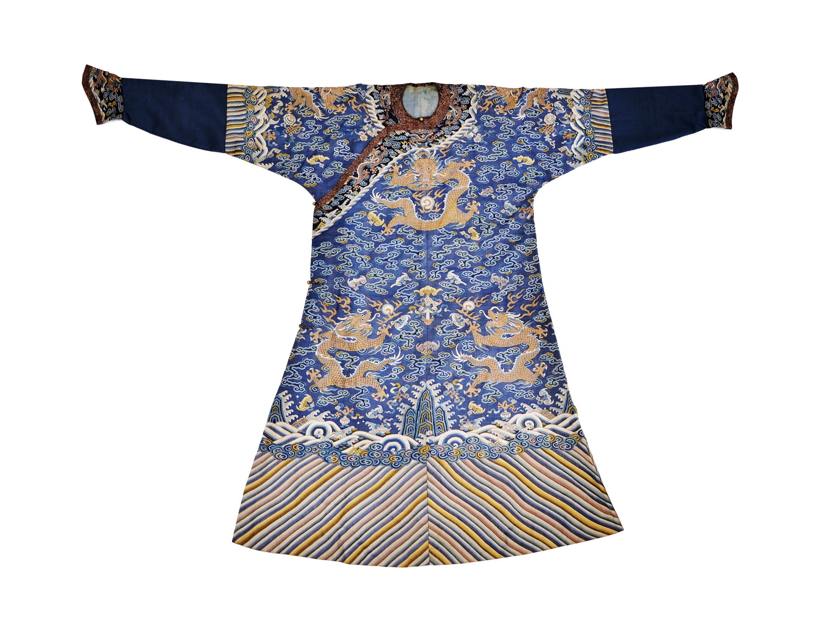 Fine Chinese 'Kesi' Dragon Robe: Robe meticulously embroidered with brass threads depicting dragons pursuing flaming pearls amidst a celestial landscape of scrolling clouds and auspicious emblems. The deep blue silk ground is further