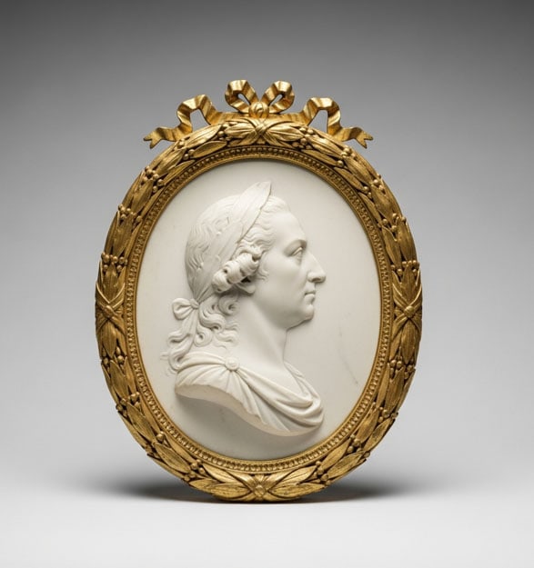 Framed Marble Portrait: Finely carved Neoclassical white marble oval relief medallion, dating to the late 18th or early 19th century, featuring a distinguished male profile portrait facing right. , H: 13 cm