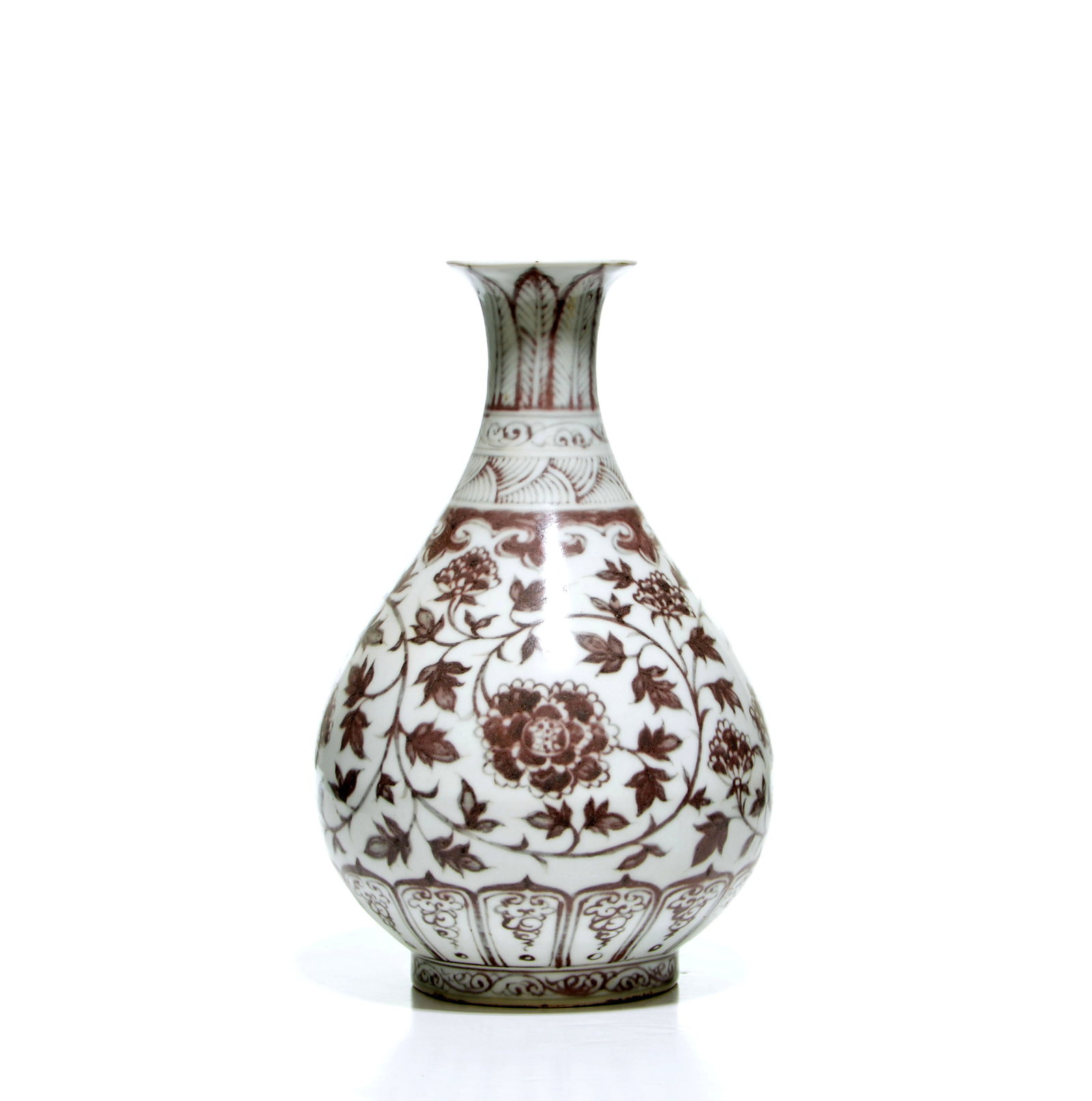 Chinese Copper-Red 'Floral' Vase: The pear-shaped porcelain vase is decorated in iron-red with scrolling floral sprays, beneath a band of ruyi-head scrolls and stylised overlapping leaves on the waisted, flared neck. The lower body
