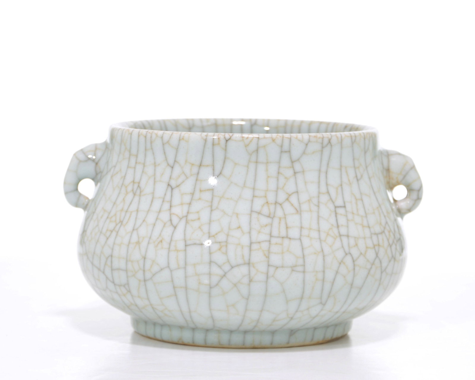 Chinese Crackle-Glazed Censer: The compressed globular body rises from a short circular foot to a broad, slightly flared neck, flanked by a pair of pierced loop handles. It is covered overall in a pale blue-green glaze suffused