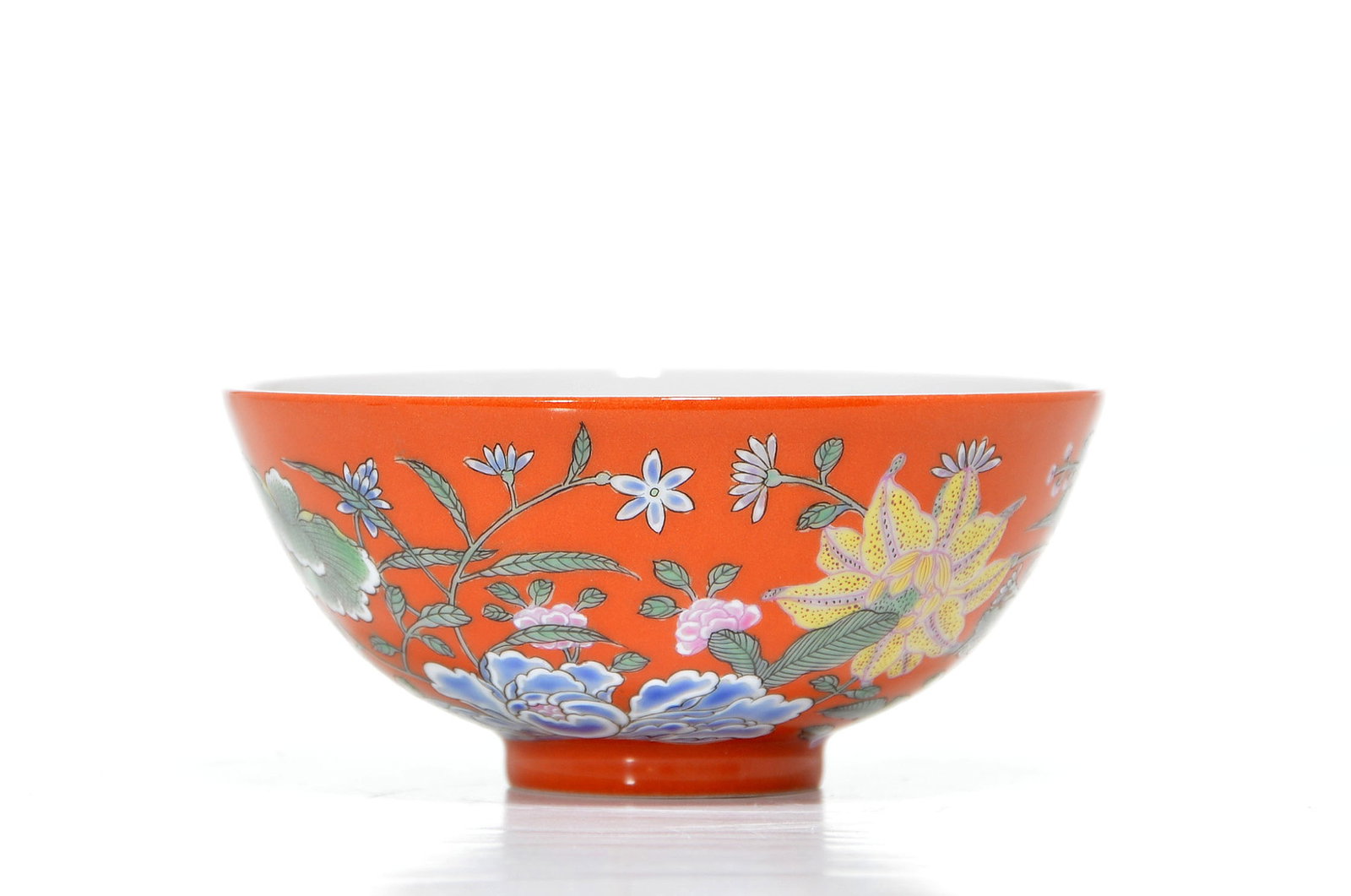 Very Fine Chinese Yangcai-Style Floral Bowl: Bowl of deep rounded form rising from a short foot, featuring a vibrant iron-red ground decorated with an array of finely enameled floral motifs. The exterior exhibits a lush garden of peonies,