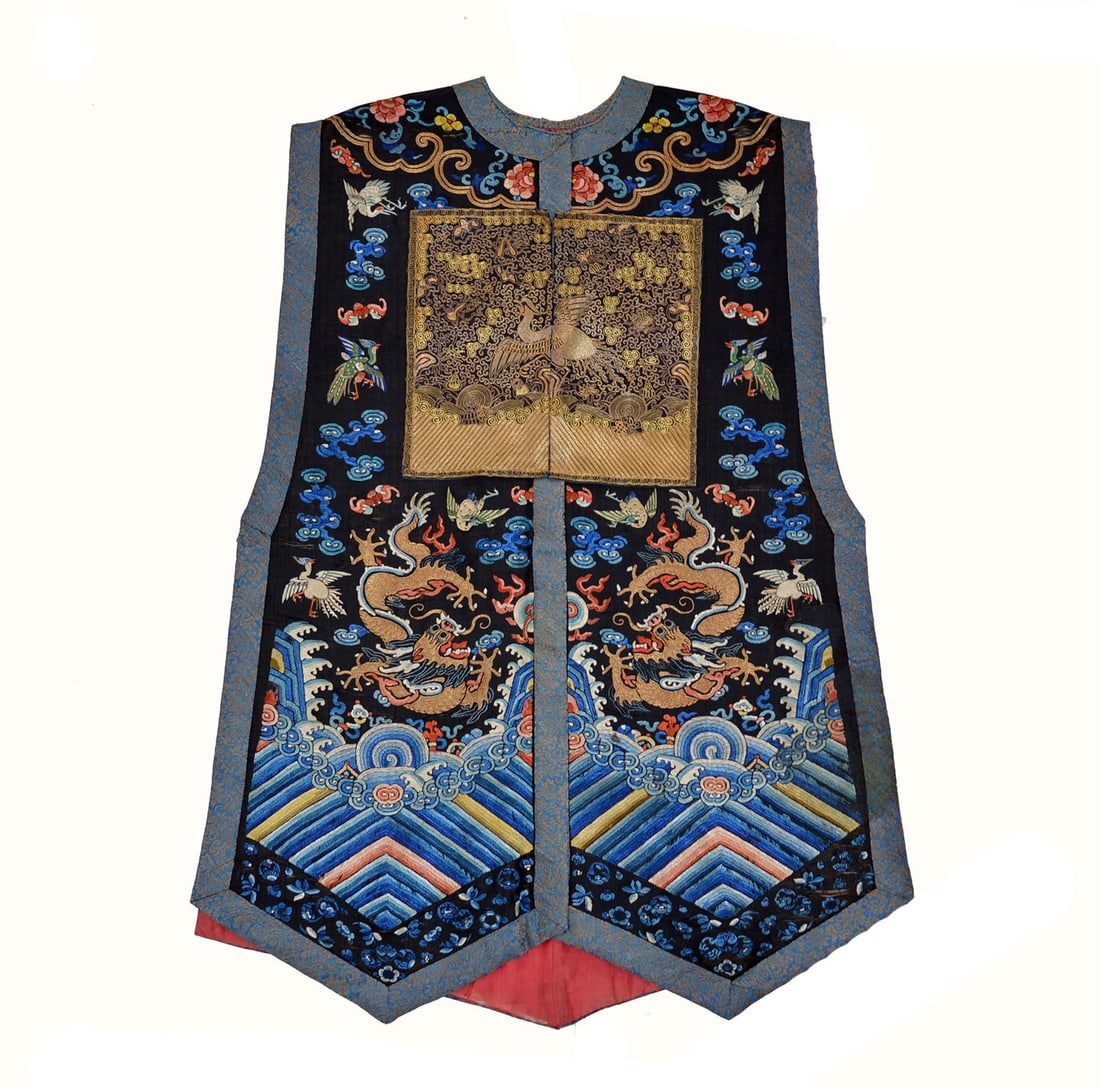 Chinese Embroidered Silk Dragon Robe: Embroidered silk vest featuring a central rank badge depicting a crane among clouds, finely worked in brass-wrapped and vibrant polychrome threads upon a dark ground. The flanking panels are ornately 