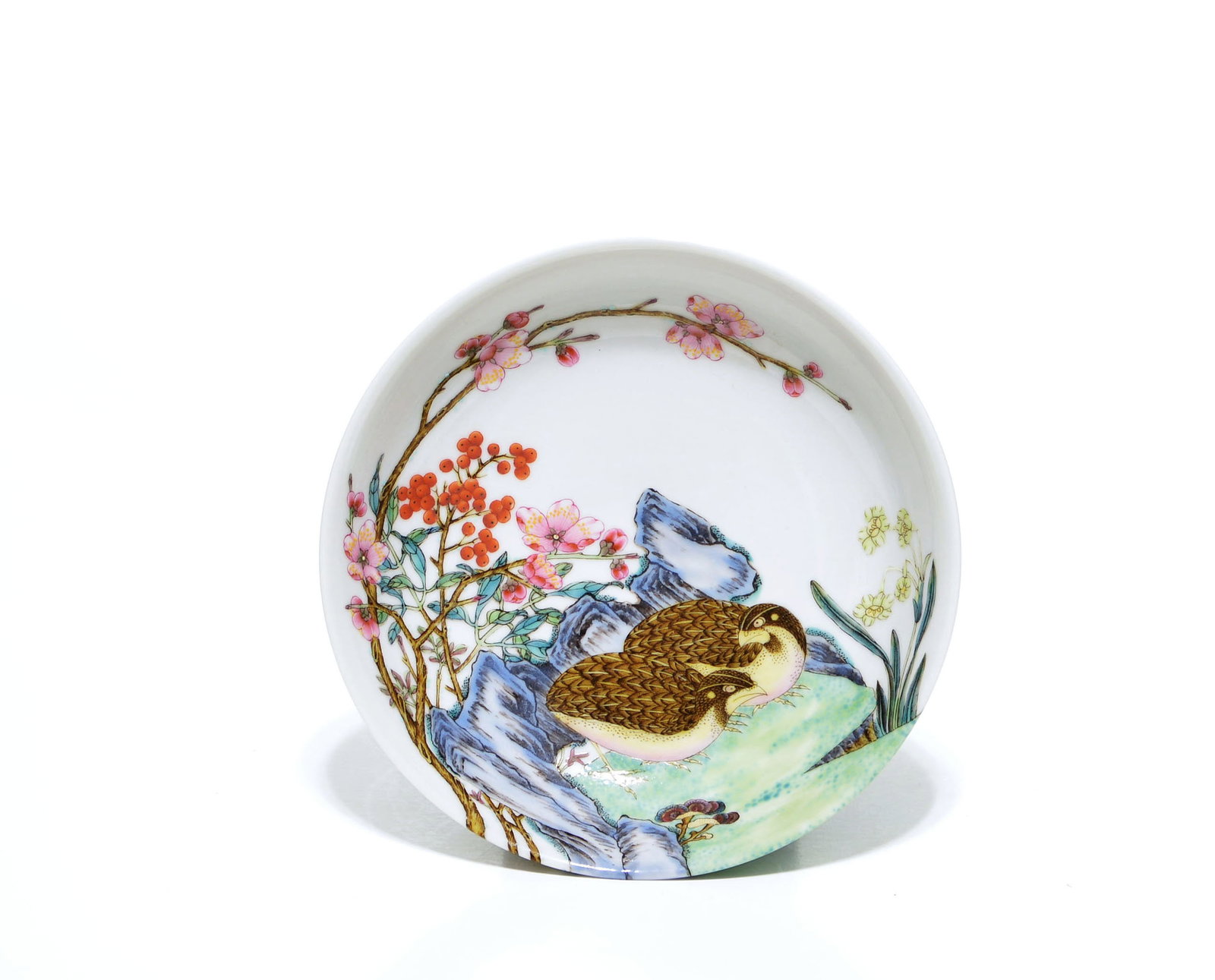 Rare Chinese Enameled Porcelain Quail Bowl: The shallow bowl is raised on a short tapered foot and has gently flared sides. It is painted in enamels with two quail amid flowering branches, fruiting sprays, rocks, fungi and grasses, with