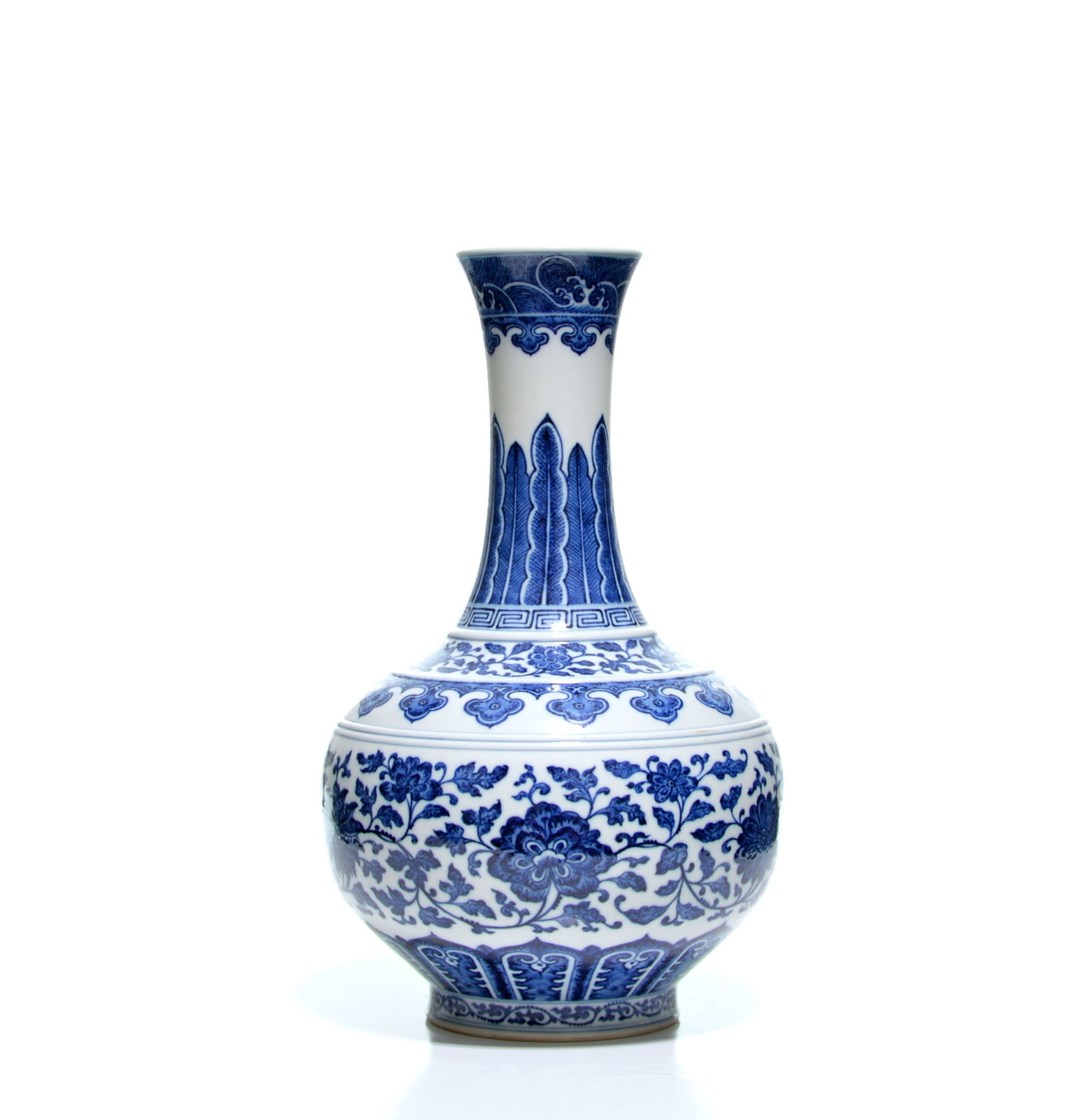 Chinese Blue and White Bottle Vase: The pear-shaped body rises from a slightly splayed foot to a tall waisted neck and flared rim, all under a clear glaze. It is painted in cobalt blue with a continuous floral scroll, formal lappet band