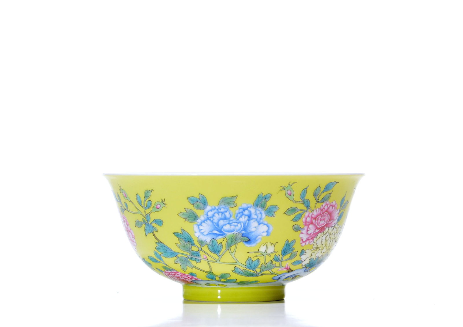 Fine Chinese Yellow-Enamel Peony Bowl: The glazed porcelain bowl is potted with gently flared sides rising from a short straight foot. The yellow ground is painted with continuous flowering peony sprays in pink, blue and white, with leafy 