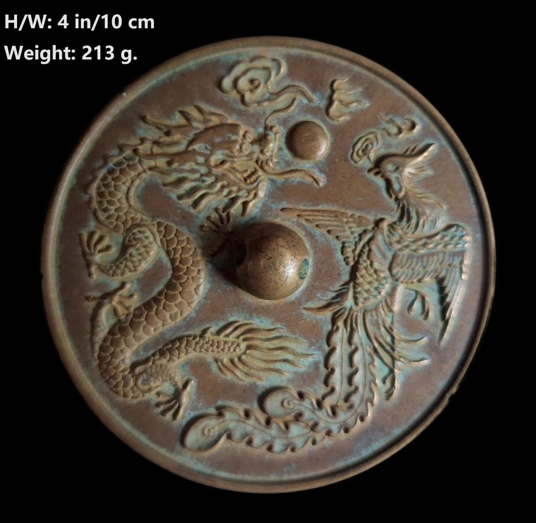 CHINESE ANTQIQUE BRONZE MIRROW DECORATED WITH DRAGON AND PHOENIX S: THIS ITEM H: 4 in/10 cm W: 4 in/10 cm Weight: 213 g. FEATURES 1. Hand carved the dragon, phoenix, and luck clouds. 2. The Chines poem: Hua Kai Rong Yan Zu, Chang Zhan Si Shi Chun The flowers bloom bri