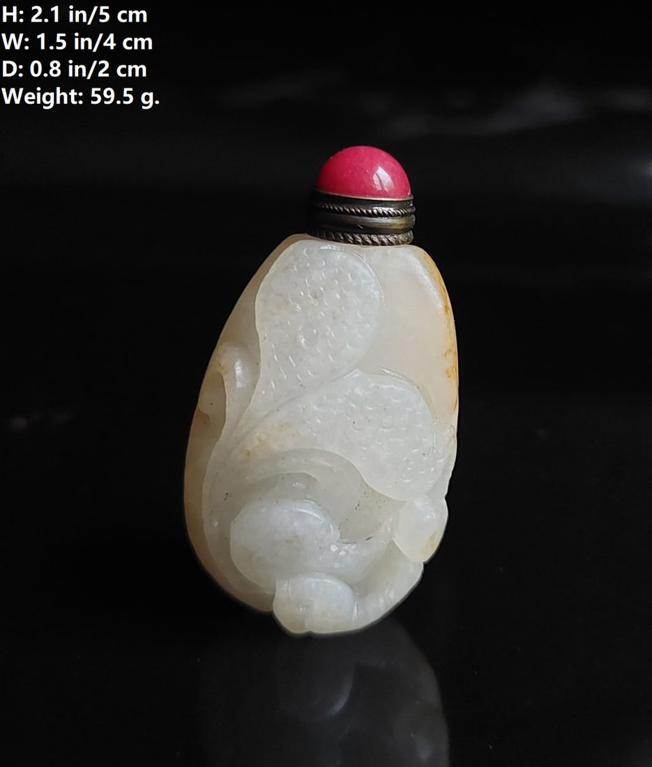 CHINESE VINTAGE HETIAN JADE SNUFF BOTTLE WITH SKIN: THIS ITEM H: 2.1 in/5 cm W: 1.5 in/4 cm D: 0.8 in/2 cm Weight: 59.5 g. FEATURES 1. Natural He Tian Jad snuff bottle. 2. Hand carved a golden fish, water, and waves. 3. The theme of the images on the b