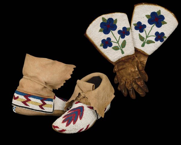 A pair of beaded moccasins and gauntlets, last qu