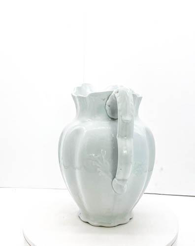 Royal Ironstone Pitcher by Johnson Bros. England: Royal Ironstone China -Large, approximately 11 inches in height from highest point, Johnson Bros. white pitcher made in England. Has a delicate leaf design in random places and an engraved hallmark co