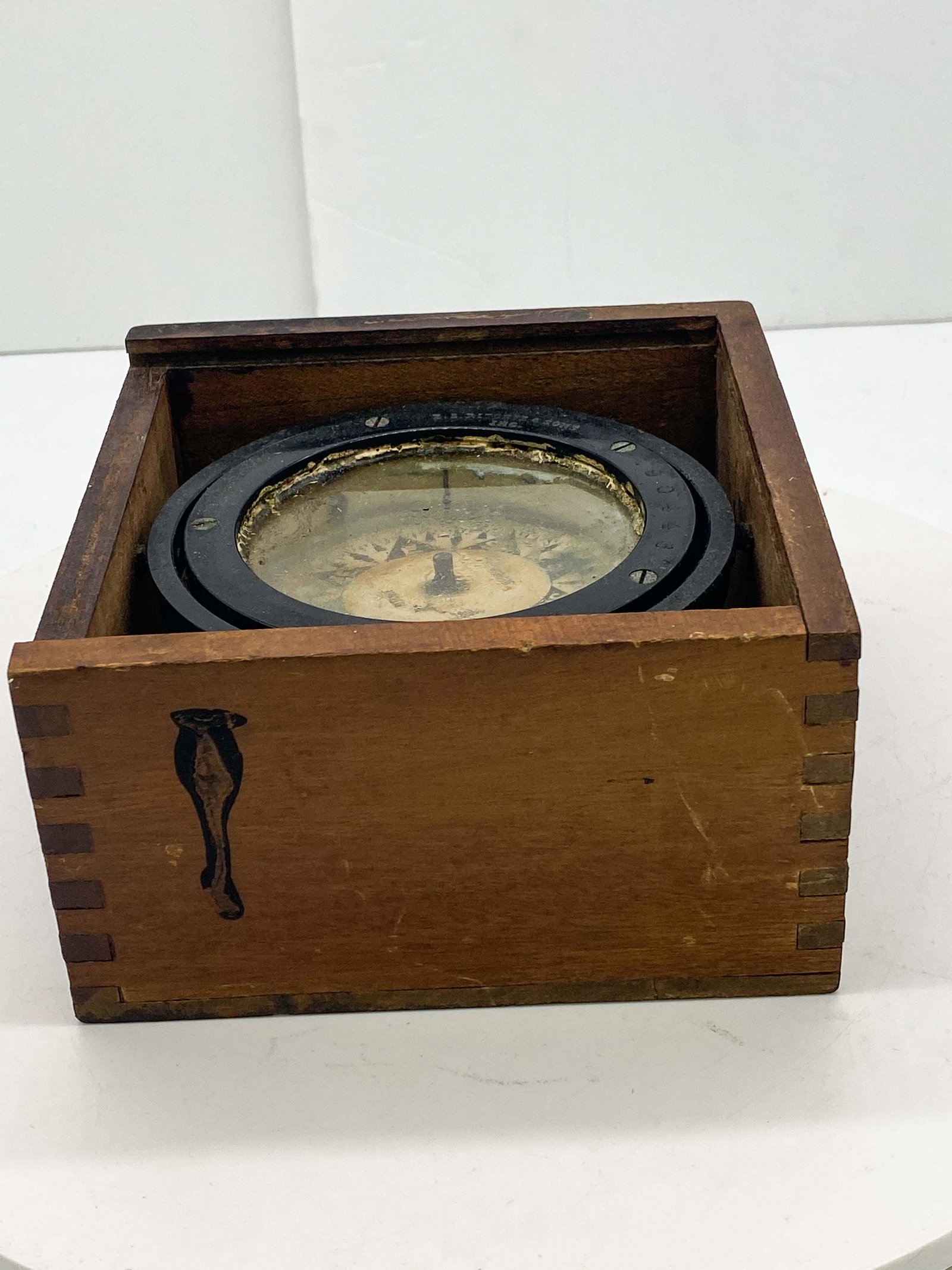 Richie CO Boston Mass. Ships Compass: B.S. Richie & Sons Inc Boston Mass. Antique Ships Compass in wooden box. Housing box is missing top piece and bears some scratches and dings. Compass itself maintains full range of motion and use. Met