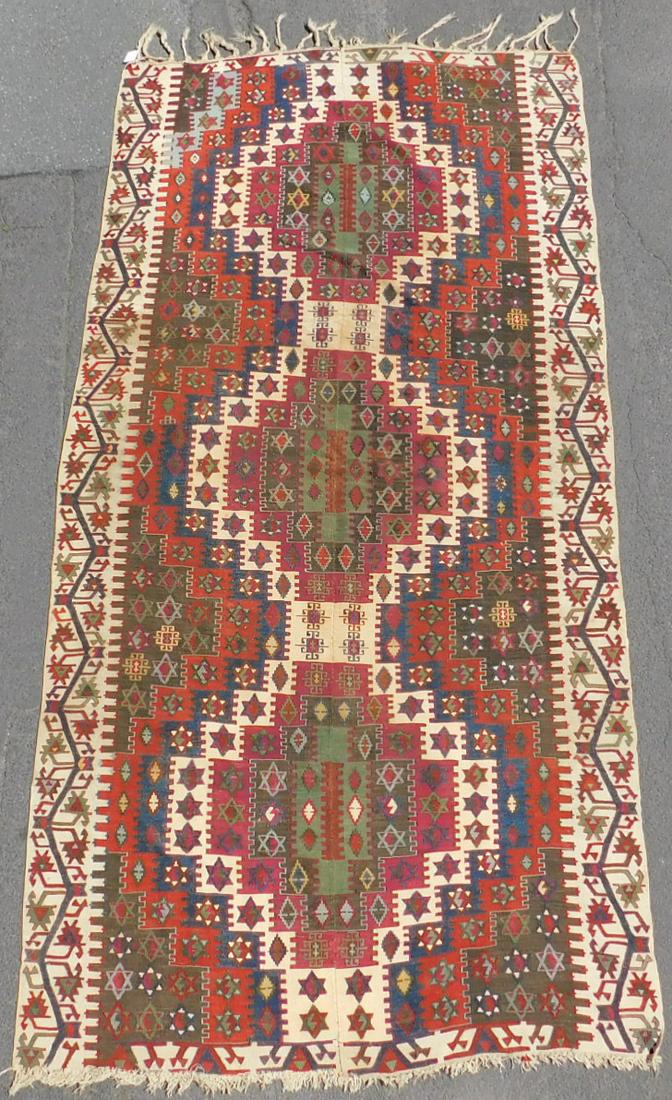 Kilim. Anatolia. Turkey. Antique, about 150 - 200 years: 330 cm x 160 cm. Hand-woven. Wool and cotton on wool. The use of cotton and the stacked warp make an origin in Central to Eastern Anatolia seem most likely. Probably still natural dyes. Collector's it