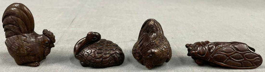 4 netsuke. Probably Japan antique.: Carved hardwood. Probably 3 x marks, signed?