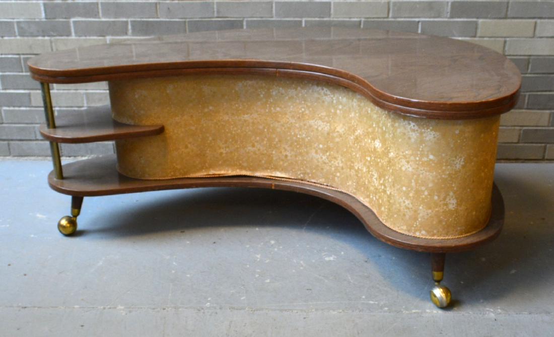 Mid century "Grand-Server / Stock" (A.H. Stock: Mid century "Grand-Server / Stock" (A.H. Stock Manufacturing Co., Newtown, Wisc.) boomerang kidney shaped coffee table/bar with Formica top – mounted on small turned legs with wheels and gold speckl