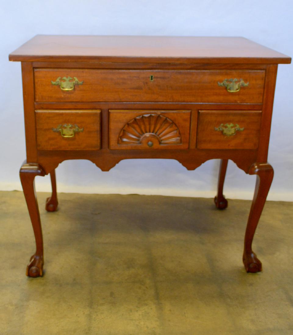 Custom made Chippendale mahogany lowboy with claw and: Custom made Chippendale mahogany lowboy with claw and ball feet, having a large drawer over 3 small drawers, one with shell carving. Top with some scratch marks but overall very good condition. Early