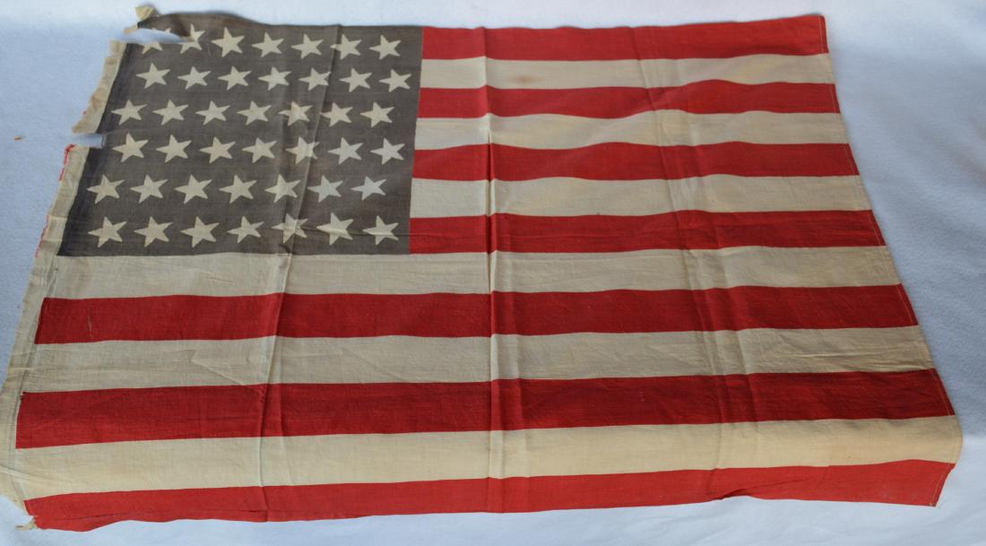 Vintage American flag having 42 printed stars. Note: Vintage American flag having 42 printed stars. Note that this flag was used for only 243 days before Idaho became a state in 1890 and never became official - 24" x 31". There is a 5" tear in the upper
