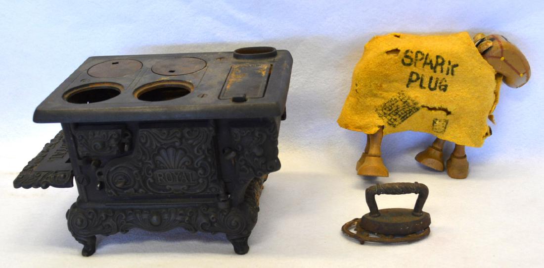 Two early toys including a wooden "Spark Plug" jointed: Two early toys including a wooden "Spark Plug" jointed horse in original paint and with original paper label by King Features, Copyright 1922, Syndicate Inc. – comes with original blanket and leathe