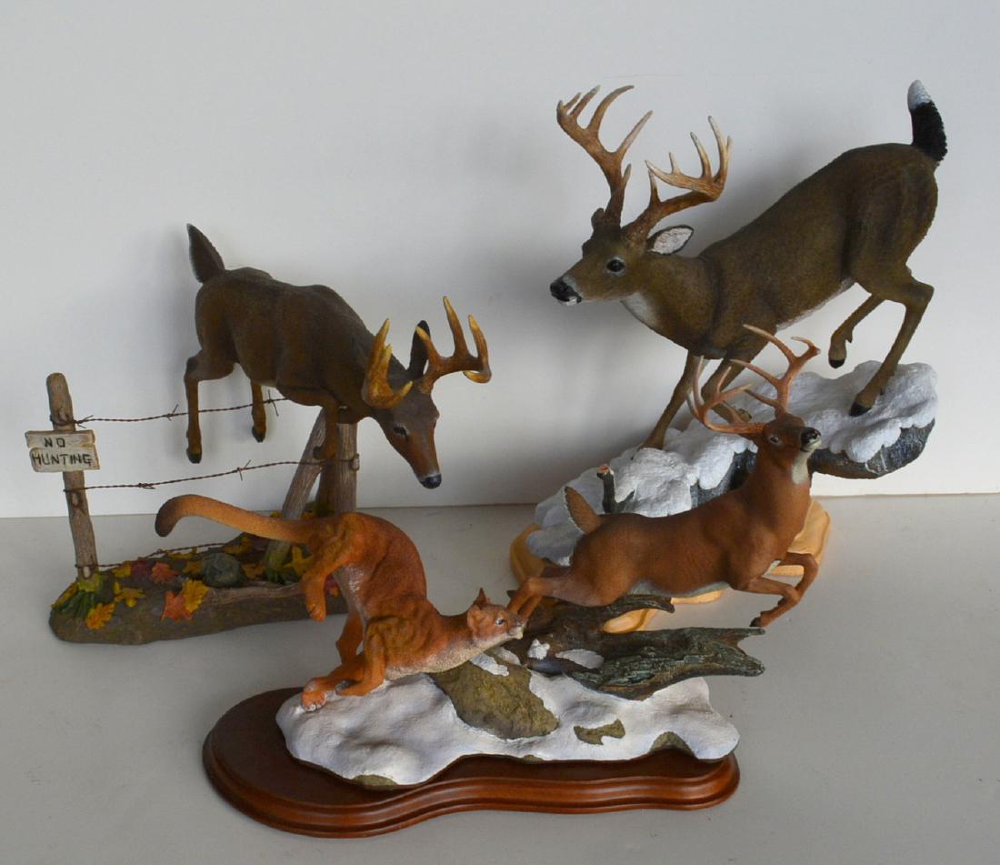 Three Whitetail Deer wildlife composition action: Three Whitetail Deer wildlife composition action sculptures including mountain lion chasing buck entitled "Hot Pursuit" by Nick Bibby" and issued by the Danbury Mint - 11"L x 7.5"H, whitetail buck jum