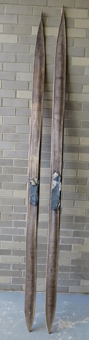 Pair of old Scandinavian wooden skis with incised folk: Pair of old Scandinavian wooden skis with incised folk art decorations on front and rear of skis. Late 19th to early 20th century. 95.5”L. Weathered, bindings missing, overall good structural condit
