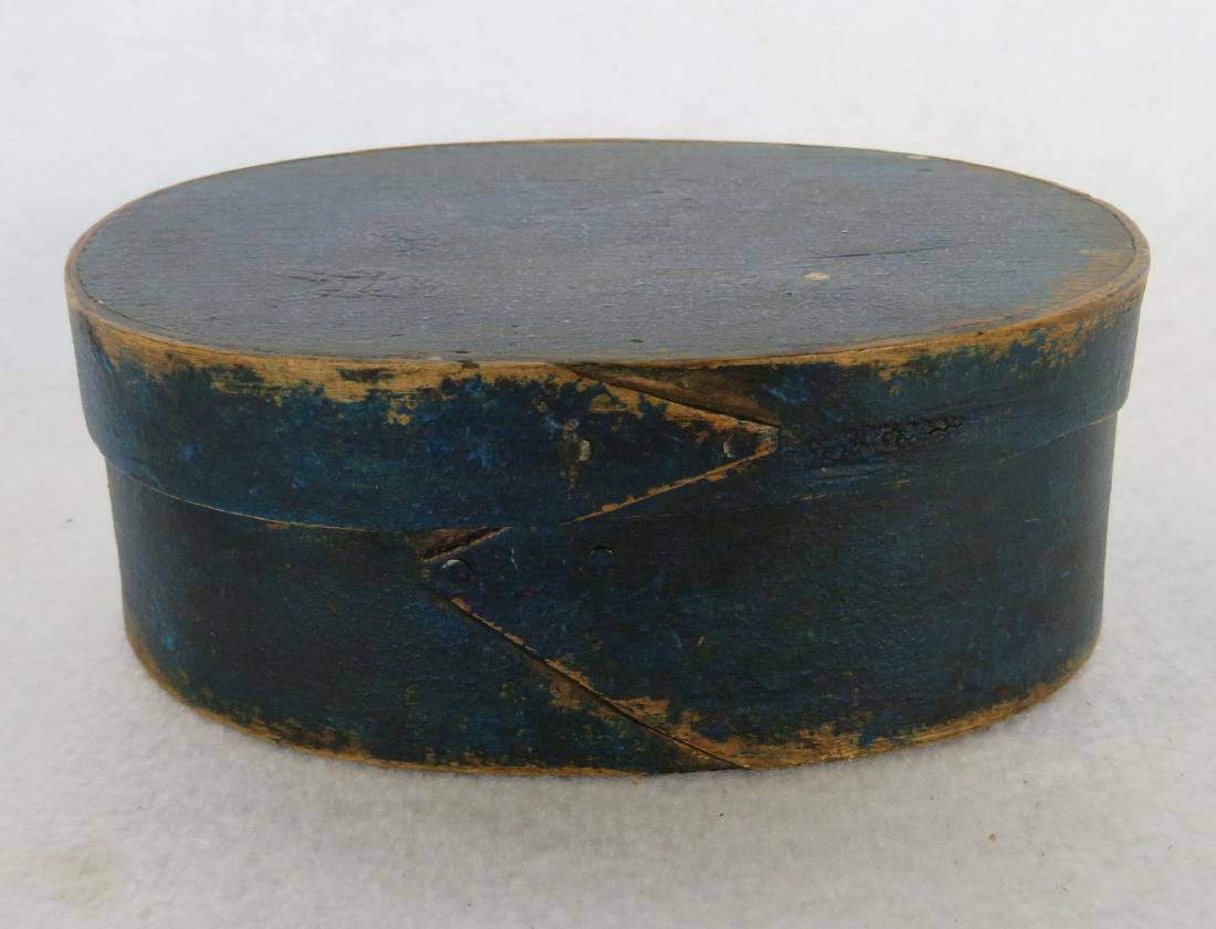 Miniature oval pantry box in blue paint, appears to be (1 of 8)