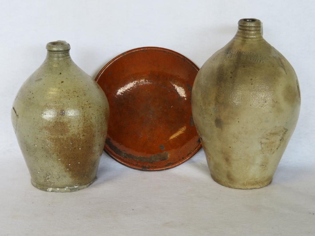 Two early ovoid jugs and a redware plate. (1 of 8)