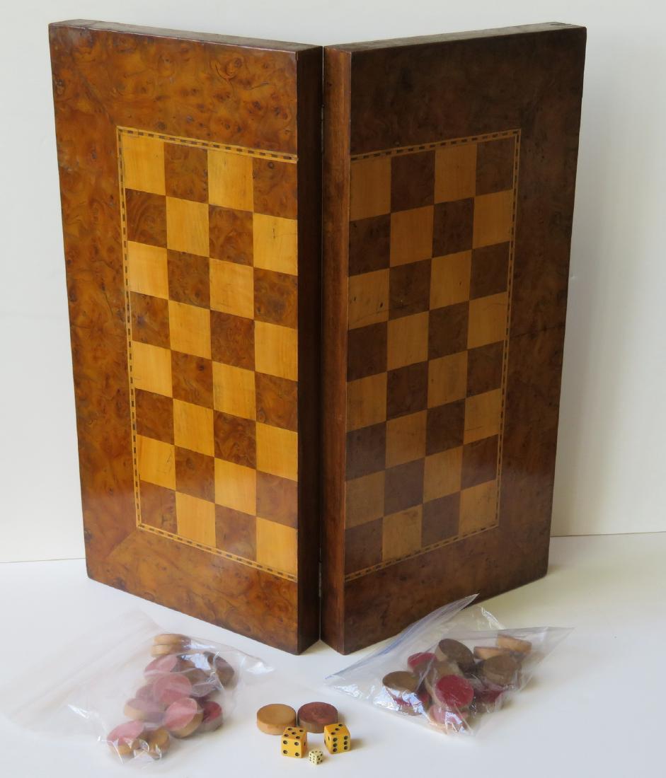 Handmade maple and burl wood folding game board with a: Handmade maple and burl wood folding game board with a set of old wooden checkers – front has an inlaid American checkerboard which opens to an inlaid backgammon game board on interior. Late 19th to