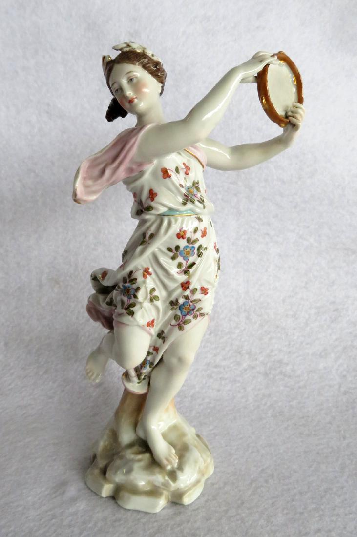 Meissen hand painted porcelain figurine of a dancing: German hand painted porcelain figurine of a dancing lady with tambourine - 8.25"H. Probably late 19th century and possibly Meissen. Blue cross swords mark on base. Excellent condition.