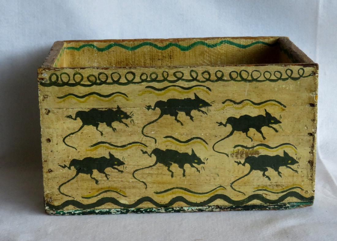 Old wooden box with open handles on sides - paint: Old wooden box with open handles on sides - paint decorated with rats on the front panel and flowers and hearts on the ends. Probably an old soda crate and painted and used as a kindling box. Similar 