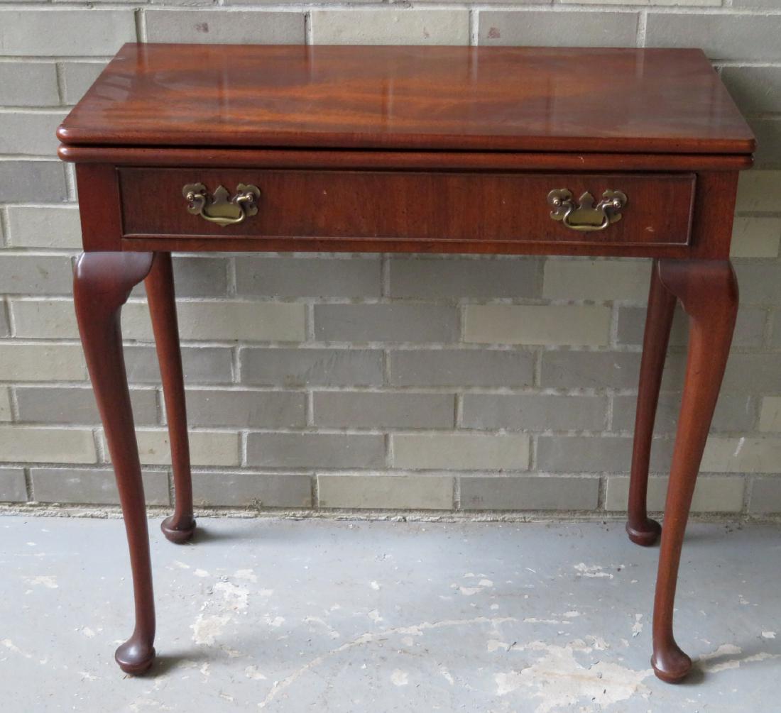 Mahogany Queen Ann style game table with center drawer: Mahogany Queen Ann style game table with center drawer – late 20th century. Very good condition.