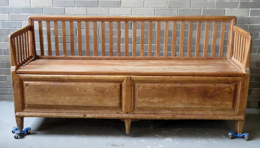 Early English day bed/bench with fluted slats across: Early English day bed/bench with fluted slats across back and under arms – lift top seat opens to expose sleeping area which pulls out to form a sleeping area twice the size of the depth (can also b