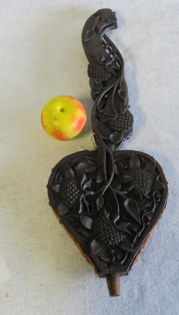 An unusual Victorian walnut black forest carved wooden: An unusual Victorian walnut black forest carved wooden bellows having long handles decorated with flowers on a vine - missing the brass nozzle, 1/2" piece of vine missing on one side that also has a h