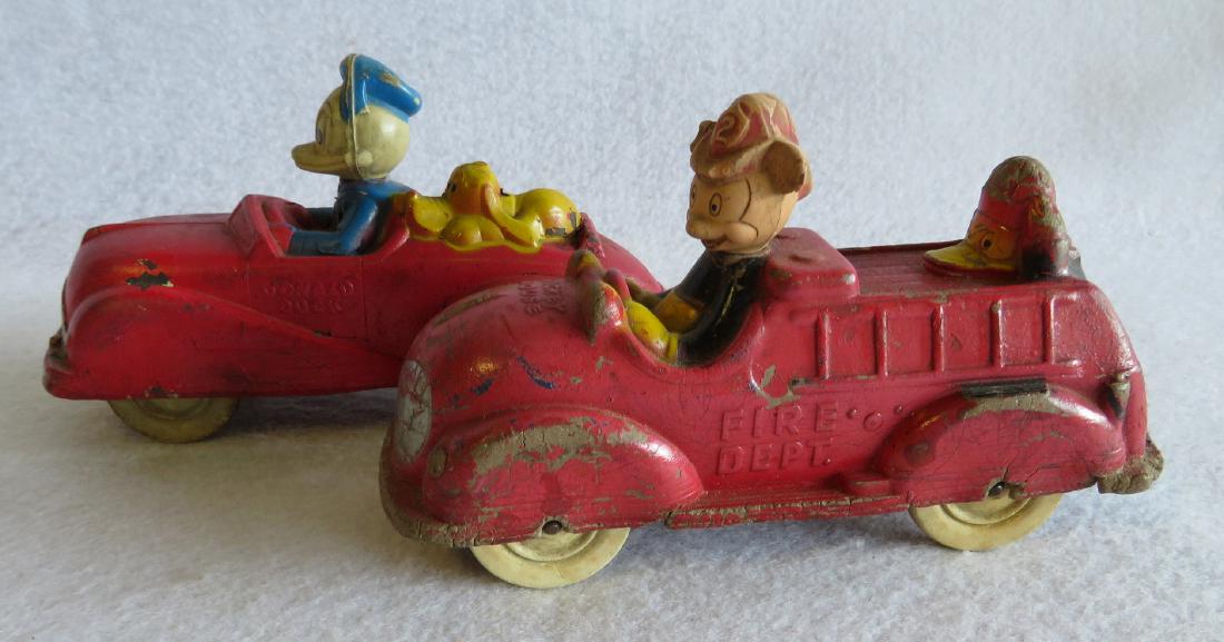 Two Sun Rubber toy vehicles including Donald Duck auto: Two Sun Rubber toy vehicles including Donald Duck auto – very good condition, and Mickey Mouse Fire Truck – small loss to Mickey’s right ear, small losses/cracks on bottoms of right fenders and