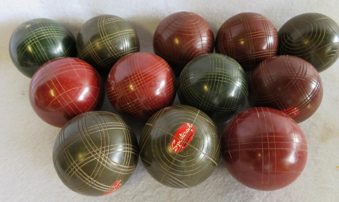 Grouping of 12 wooden lawn balls, most matching and: Grouping of 12 wooden lawn balls, most matching and signed Sportcraft. All in very good condition. Circa 1950’s or earlier.