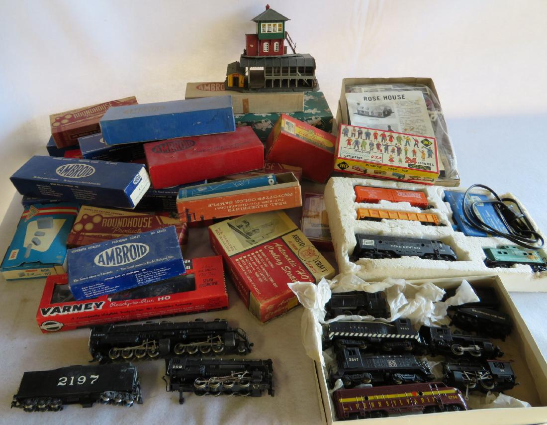 Large grouping of HO trains & accessories including:: Large grouping of HO trains & accessories including: Model HO trains in original boxes to be assembled, various buildings, 6 steam engines, Varney Engine 1392 with tender in original box, Rivarossi st