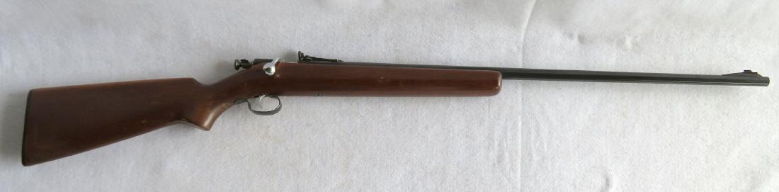 Winchester Model 68, 22 caliber bolt action rifle with: Winchester Model 68, 22 caliber bolt action rifle with walnut stock - while 90% of bluing is present, there are 2 small rust spots, near the end of the barrel, but overall very good condition in worki