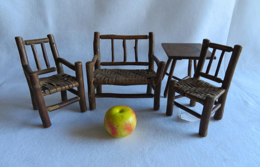 Four matching pieces of Adirondack doll furniture: Four matching pieces of Adirondack doll furniture including settee, 2 chairs, and table. All made from hickory and the chairs with splint cane seats - minor breaks in the splint caning, overall very g