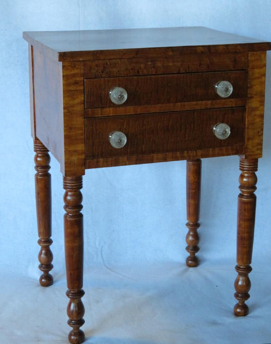 Sheraton 2 drawer sewing stand, all in tiger and: Sheraton 2 drawer sewing stand, all in tiger and birdseye maple with darkened varnish finish - drawers with early glass pulls (one with edge chip), probably not original. 29.75"H x 20.5"W x 16.5"D. Ve