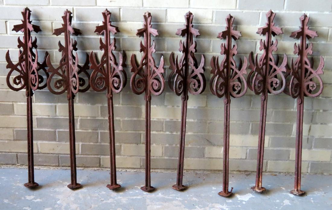 Grouping of 8 matching cast iron architectural building: Grouping of 8 matching cast iron architectural building ornaments, probably from a Widow's Walk, 19th century in old crusty red paint - all original. 33"H x 9"D. Two sections with small cracks, hardly